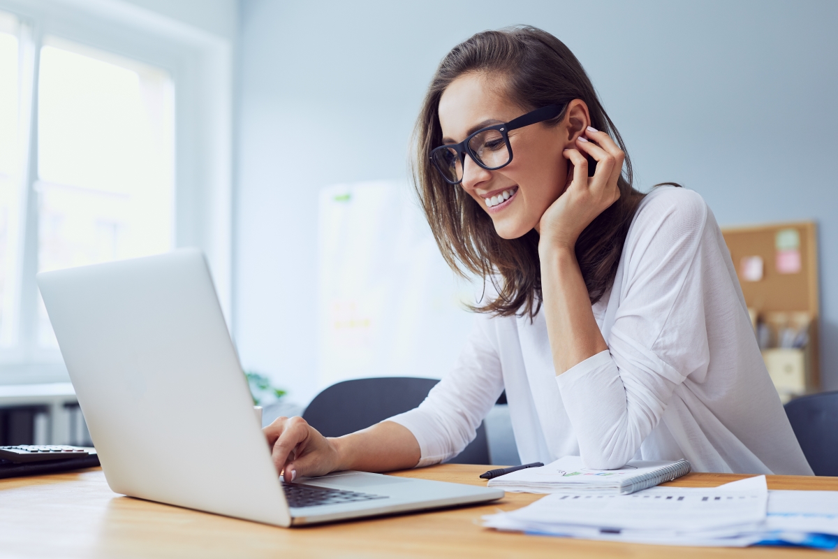 Women sitting at desk looking at computer for Search Intent Tips